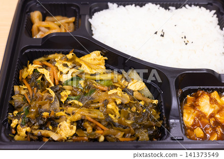 Delicious Chinese bento box with stir-fried mustard greens and eggs Delicious Chinese bento box with stir-fried mustard greens and eggs 141373549