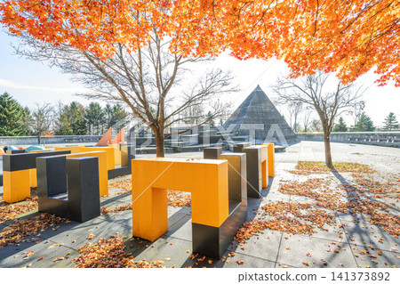 Autumn leaves and a pyramid-shaped toilet at Moerenuma Park, Sapporo City Autumn leaves and a pyramid-shaped toilet at Moerenuma Park, Sapporo City 141373892