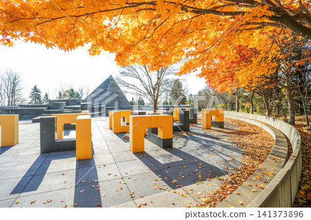 Autumn leaves and a pyramid-shaped toilet at Moerenuma Park, Sapporo City Autumn leaves and a pyramid-shaped toilet at Moerenuma Park, Sapporo City 141373896