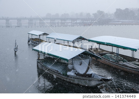 Togetsukyo Bridge and houseboats in winter Togetsukyo Bridge and houseboats in winter 141374449
