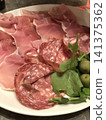 Raw ham and salami 141375362