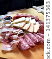 Assorted raw ham and cheese 141375363