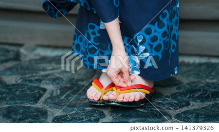 Japanese summer - the feet of a woman in a yukata Japanese summer - the feet of a woman in a yukata 141379326