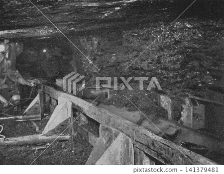 Old photograph, 1951, Sasebo City, Nagasaki Prefecture: Hobel (coal mining machine) and belt conveyor at the coal face (mining site) of the Shikamachi Coal Mine. Old photograph, 1951, Sasebo City, Nagasaki Prefecture: Hobel (coal mining machine) and belt conveyor at the coal face (mining site) of the Shikamachi Coal Mine. 141379481