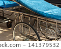 Empty hospital stretcher blue mattress prepared for patient transport medical facility highlighting emergency care healthcare safety clinical readiness 141379532