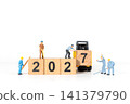 Miniature Construction Workers and Forklift Building 2027 New Year Wooden Block Concept 141379790