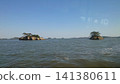 An island floating in the sea 141380611