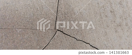 Intersecting cracks on the surface of weathered rock. 141381663