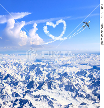 Airplane drawing heart in sky over the mountains. Jet flight route of aircraft in shape of heart. Heart-shaped flight path drawn by plane. Topic of holiday, travel, trip abroad on vacation, tour Airplane drawing heart in sky over the mountains. Jet flight route of aircraft in shape of heart. Heart-shaped flight path drawn by plane. Topic of holiday, travel, trip abroad on vacation, tour 141381851