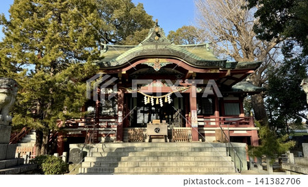 Ornate Japanese shrine surrounded by tall trees Ornate Japanese shrine surrounded by tall trees 141382706