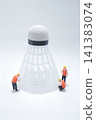 Miniature workers inspect a large badminton shuttlecock object. 141383074