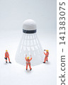 Miniature workers inspect a large badminton shuttlecock object. 141383075