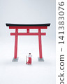 Miniature Shinto priest and maiden by torii gate. 141383076