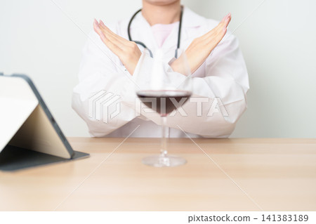 Doctor hand stop to refuse Wine, quitting drink for healthy liver, prevent Alcoholic cirrhosis and cancer, World No Alcohol Day, medical advice for sobriety and Alcoholism and addiction concept Doctor hand stop to refuse Wine, quitting drink for healthy liver, prevent Alcoholic cirrhosis and cancer, World No Alcohol Day, medical advice for sobriety and Alcoholism and addiction concept 141383189