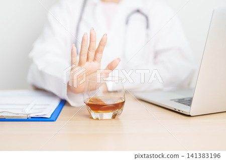 Doctor hand stop to refuse Whisky, quitting drink for healthy liver, prevent Alcoholic cirrhosis and cancer, World No Alcohol Day, medical advice for sobriety and Alcoholism and addiction concept Doctor hand stop to refuse Whisky, quitting drink for healthy liver, prevent Alcoholic cirrhosis and cancer, World No Alcohol Day, medical advice for sobriety and Alcoholism and addiction concept 141383196