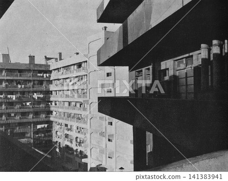 Old photograph, 1951, Gunkanjima (Battleship Island), Nagasaki: Building 65, a 9-story miners' residence (when the Hashima coal mine was still in operation). Old photograph, 1951, Gunkanjima (Battleship Island), Nagasaki: Building 65, a 9-story miners' residence (when the Hashima coal mine was still in operation). 141383941