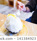 Eating shaved ice [A summer tradition] 141384923
