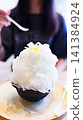 Eating shaved ice [A summer tradition] 141384924