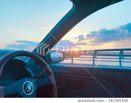 Sunset seen from the driver's seat Sunset seen from the driver's seat 141385100