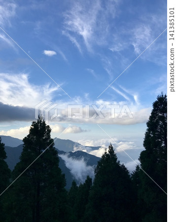 Mountains floating in the sea of clouds Mountains floating in the sea of clouds 141385101