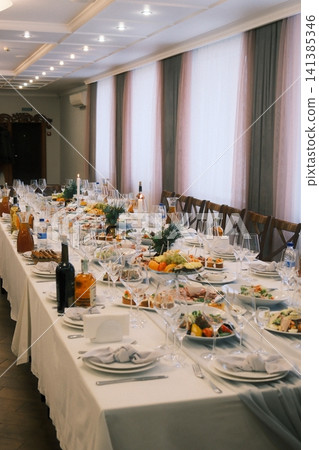 Grand banquet table awaits guests for celebration Grand banquet table awaits guests for celebration 141385346
