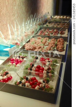 Gourmet Appetizer Buffet with Caprese Skewers and Savory Pastries 141385453