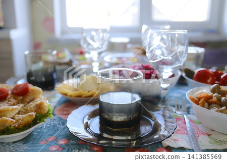 Festive daytime meal on a home dining table 141385569