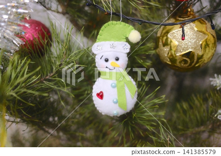 Felt snowman Christmas ornament with green hat and red heart button Felt snowman Christmas ornament with green hat and red heart button 141385579