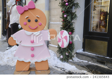 Large gingerbread girl prop in a dress and bow with candy on a stick Large gingerbread girl prop in a dress and bow with candy on a stick 141385643