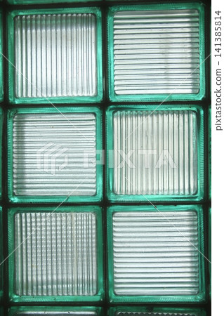 View of a wall constructed from green framed glass blocks 141385814