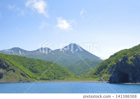 The beautiful sight of Mt. Rausu on the Shiretoko Peninsula during the season of fresh greenery. The beautiful sight of Mt. Rausu on the Shiretoko Peninsula during the season of fresh greenery. 141386308