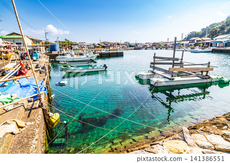 [Important Preservation District for Groups of Traditional Buildings] Dewajima Island: Early spring scenery of the fishing port viewed from the western end of Nishihatoba (west breakwater) 2 Mugi-cho, Kaifu-gun, Tokushima Prefecture 141386551