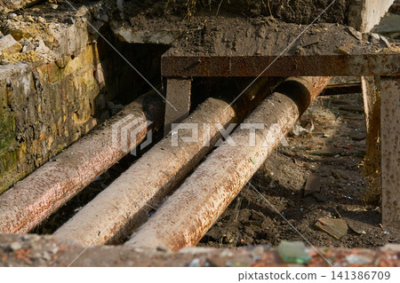 Breakthrough,old sewer pipe.Old rusty sewer tube in need of replacement Breakthrough,old sewer pipe.Old rusty sewer tube in need of replacement 141386709