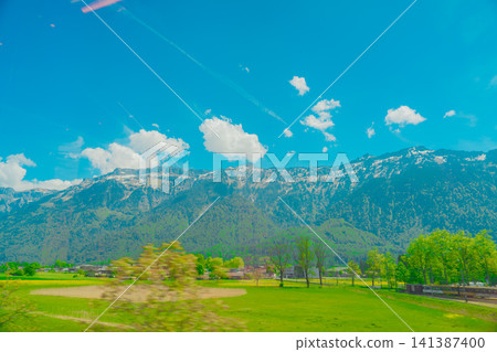 Beautiful scenery from the train window in Switzerland Beautiful scenery from the train window in Switzerland 141387400