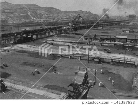 Old photograph, 1951, Kitakyushu City, Fukuoka Prefecture: Coal storage area at Wakamatsu Port near the government-owned Yawata Steel Works. Old photograph, 1951, Kitakyushu City, Fukuoka Prefecture: Coal storage area at Wakamatsu Port near the government-owned Yawata Steel Works. 141387658