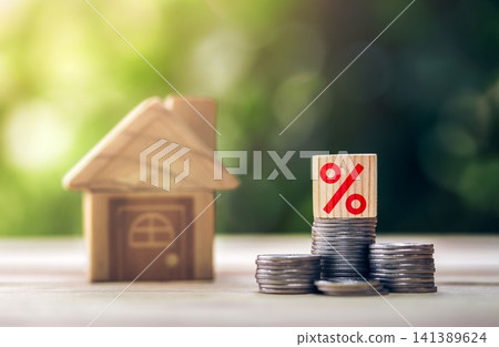 Wooden blocks interest rate and the house is placed on the table. Mortgage rates business concept of investment housing real estate interest. Wooden blocks interest rate and the house is placed on the table. Mortgage rates business concept of investment housing real estate interest. 141389624