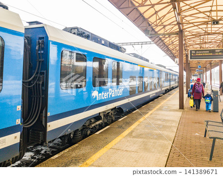 A Czech Railways (CD) Interpanter medium- and long-distance train stopped at the platform of Svitavy Station in the Czech Republic. A Czech Railways (CD) Interpanter medium- and long-distance train stopped at the platform of Svitavy Station in the Czech Republic. 141389671