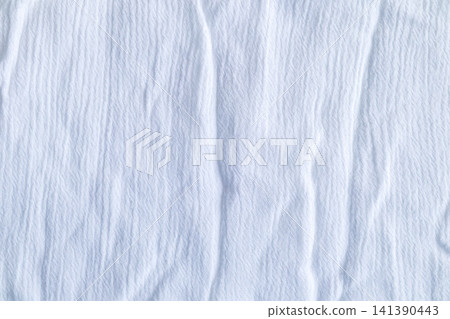 Wrinkled white fabric texture background with soft folds and subtle shadow detail for design Wrinkled white fabric texture background with soft folds and subtle shadow detail for design 141390443