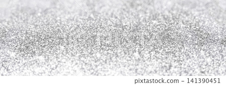 Silver glitter background with sparkling bokeh texture for festive and luxury design Silver glitter background with sparkling bokeh texture for festive and luxury design 141390451