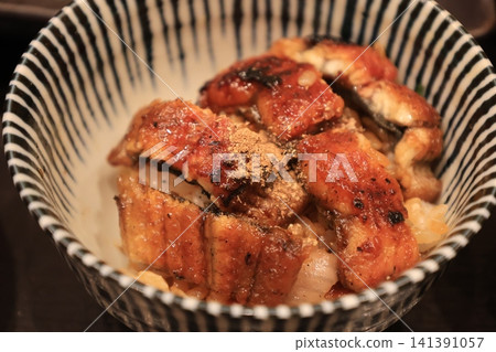 Hitsumabushi, a dish of eel served on a plate. Hitsumabushi, a dish of eel served on a plate. 141391057