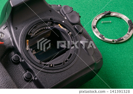 Camera malfunction; image shows a damaged SLR camera mount. Camera malfunction; image shows a damaged SLR camera mount. 141391328