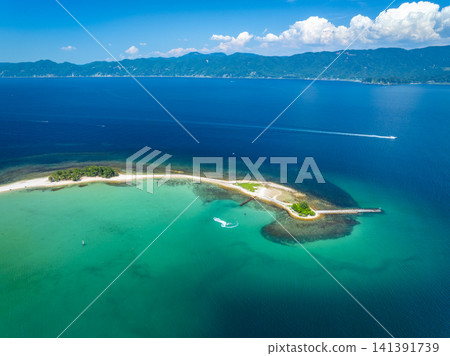 Drone footage of the stunning Mizushima Island in Tsuruga City, Fukui Prefecture, known as the "Hawaii of Hokuriku." Drone footage of the stunning Mizushima Island in Tsuruga City, Fukui Prefecture, known as the "Hawaii of Hokuriku." 141391739
