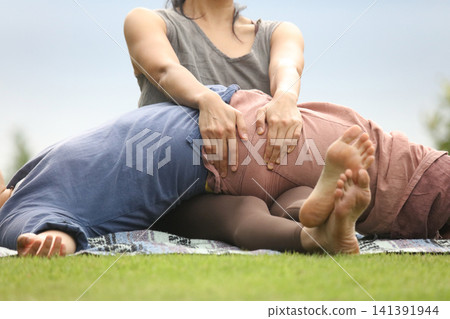 Woman doing bodywork Woman doing bodywork 141391944