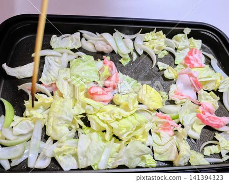 Stir-fried pork vegetables cooked in a frying pan Stir-fried pork vegetables cooked in a frying pan 141394323