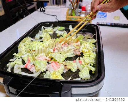 Stir-fried pork vegetables cooked in a frying pan Stir-fried pork vegetables cooked in a frying pan 141394332
