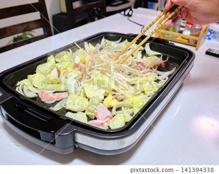 Stir-fried pork vegetables cooked in a frying pan Stir-fried pork vegetables cooked in a frying pan 141394338