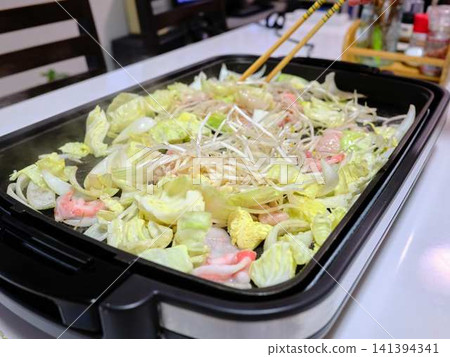 Stir-fried pork vegetables cooked in a frying pan Stir-fried pork vegetables cooked in a frying pan 141394341