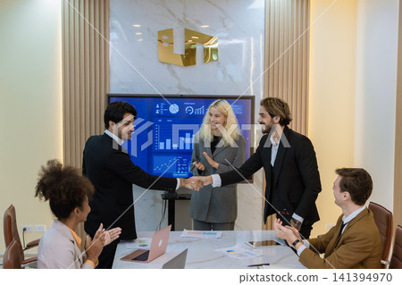 Diverse colleagues gather in brainstorm discuss statistics together. Diverse colleagues gather in brainstorm discuss statistics together. 141394970