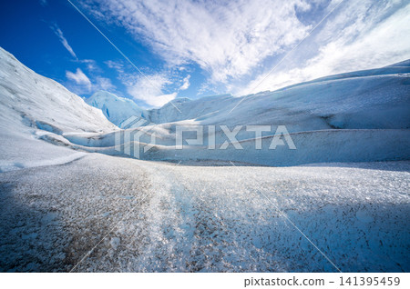 Majestic Perito Moreno glacier landscape bright sky depicts emotional calm while warning about global climate change impact nature preservation Patagonia Argentina within remote travel wilderness Majestic Perito Moreno glacier landscape bright sky depicts emotional calm while warning about global climate change impact nature preservation Patagonia Argentina within remote travel wilderness 141395459