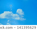Water droplets floating in the blue sky 141395629